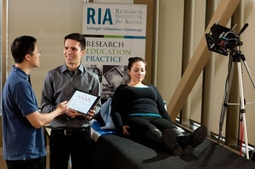 Professor Alexander Wong and Robert Amelard at the Schlegel-University of Waterloo Research Institute for Aging analyzing blood-flow data extracted with their new touchless device.