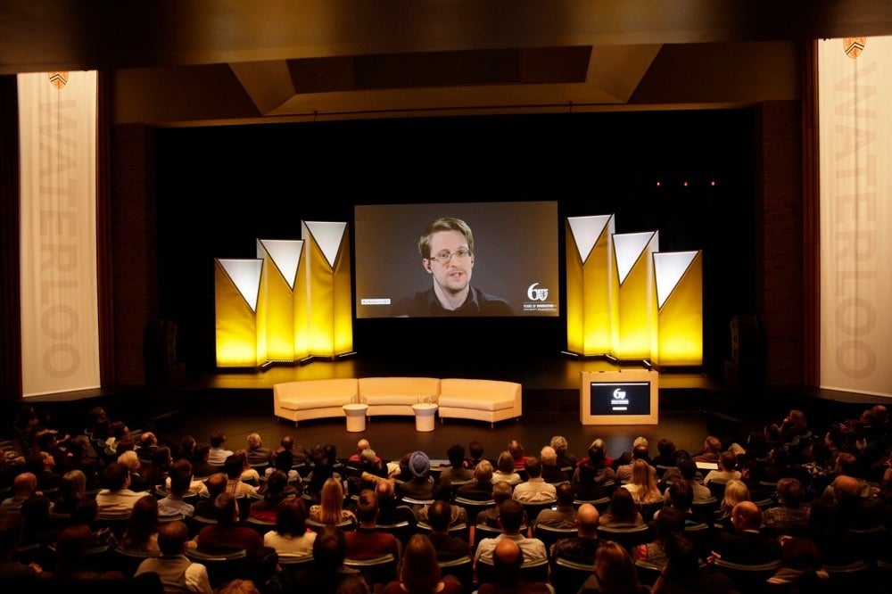 Edward Snowden speaks via remote link in the Humanities Theatre.