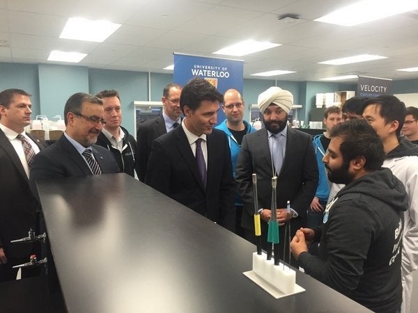 Prime Minister Trudeau with Waterloo President Feridun Hamdullahpur and Minister Navdeep Bains speak with Harry Gandhi of Medella Health.