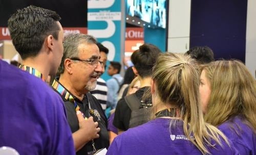 President Feridun Hamdullahpur speaks with students.