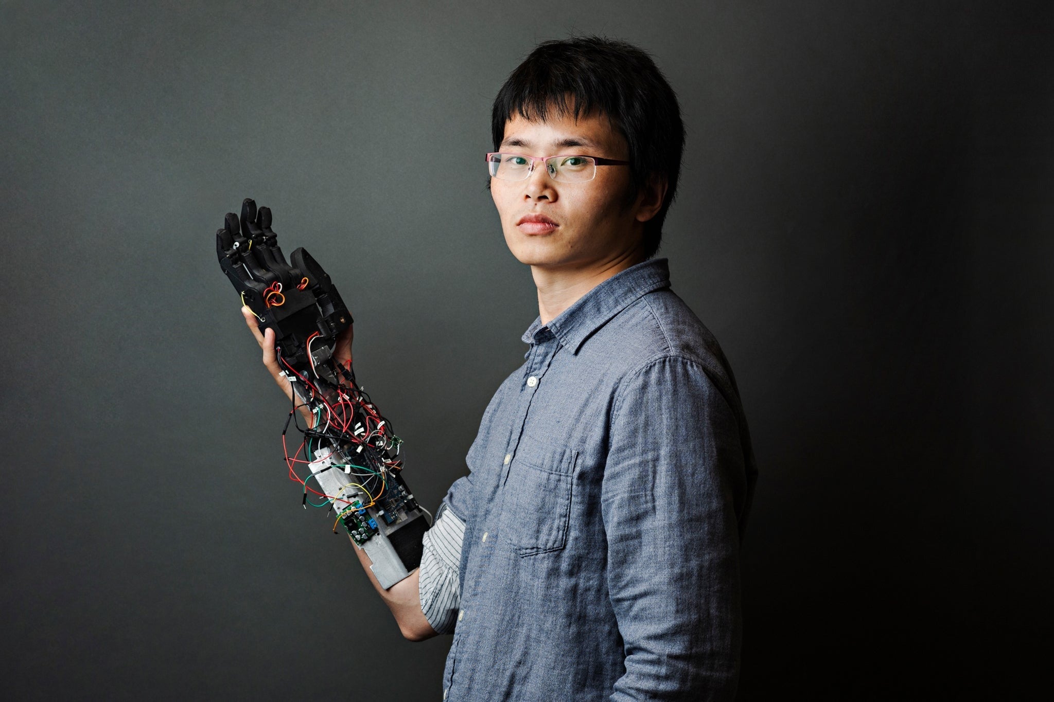 Researcher and Brink Bionics co-founder and CTO, Jiayuan He holds a smart prosthetic prototype, designed in the Engineering Bionics Lab.