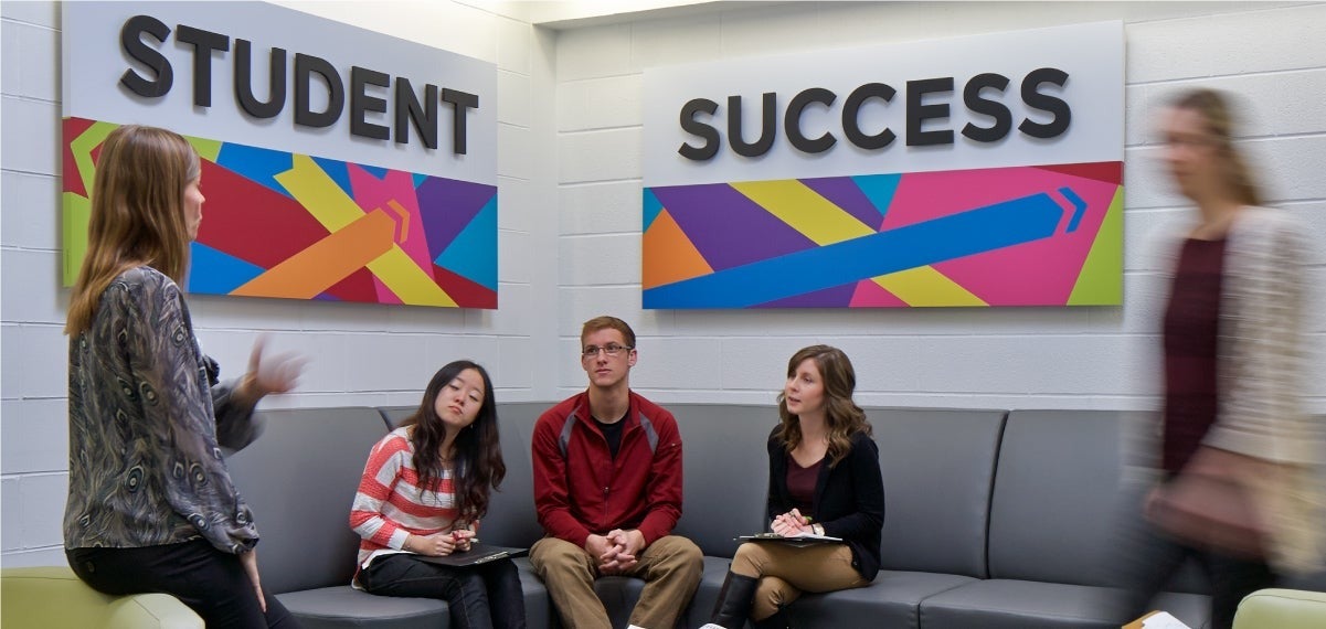 Students converse in the Student Success Office.