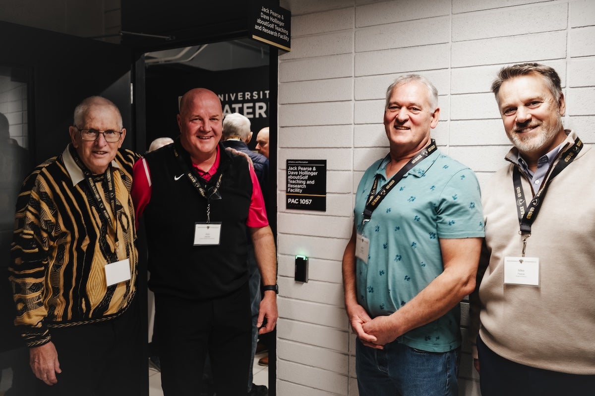 Dave Hollinger, Roly Webster, John Pearse, Mike Pearse stand next to the facility.
