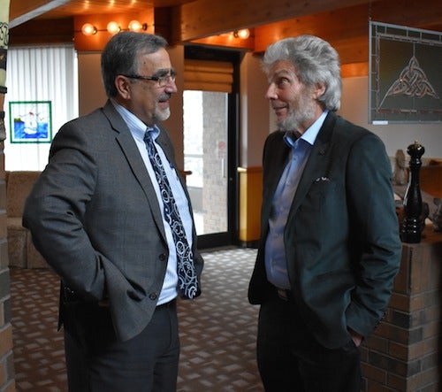 President Feridun Hamdullahpur congratulates Distinguished Professor Emeritus John Thompson at a reception celebrating his 50 years at the University.