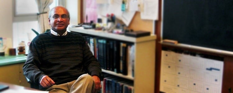 Professor Rohan Jayasundera sits in his office.