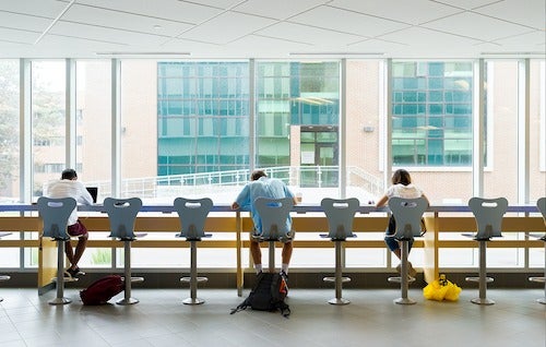 Students siting at a counter.