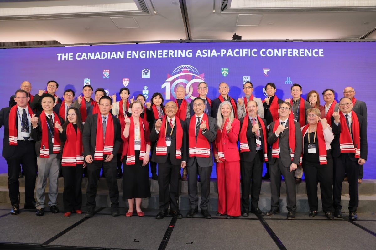 Dean Wells and her fellow Canadian dean counterparts pose with delegates at the Canada-in-Asia conference last week.