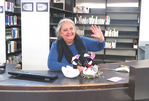 Laurie Strome at her circulation desk in the Library.