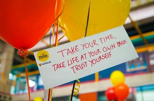 balloons and a note that reads take yourtime, take life at your own pace. Trust Yourself.