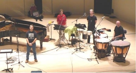 Members of the Toronto Percussion Ensemble pose with their instruments.