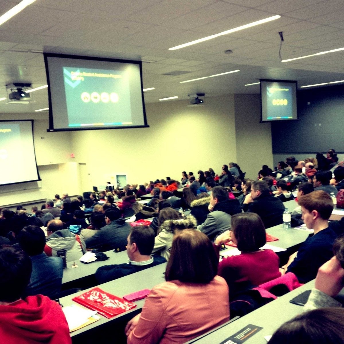 Attendees at Grade 10 Family Night in an auditorium.