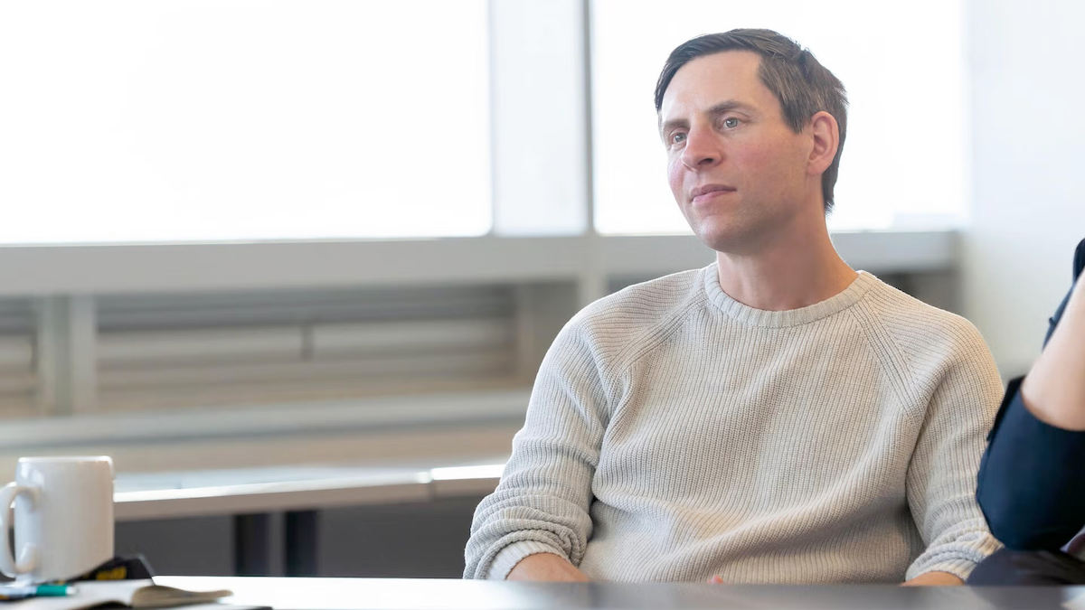 Doug Kavanagh sits at a table.