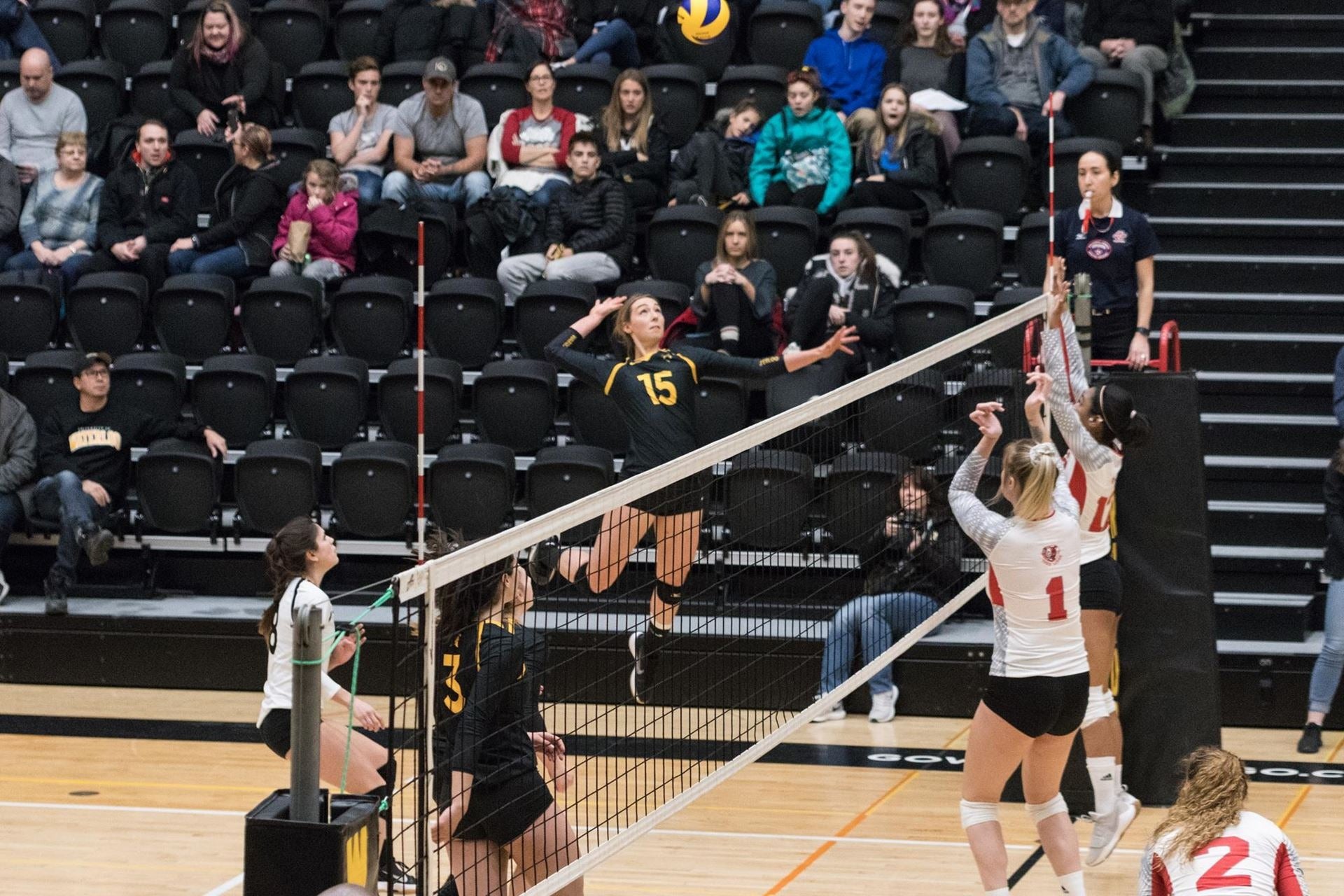 The women's volleyball team playing a game.