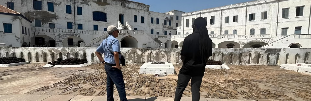 Dr. Vivek Goel and Dr. Christopher Taylor at the "gate of no return" in Ghana.
