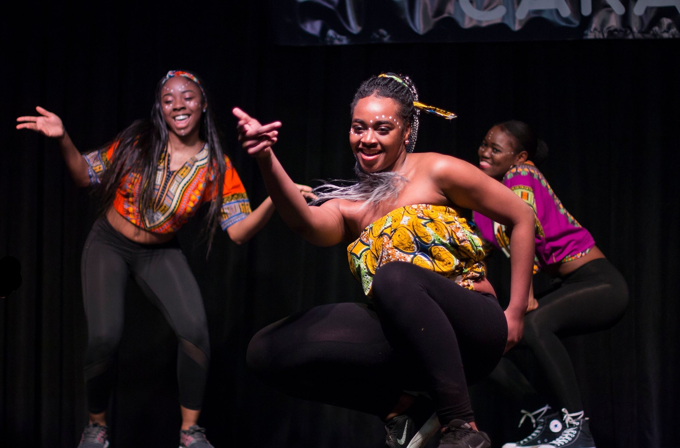 Dancers take the stage at a Cultural Caravan.