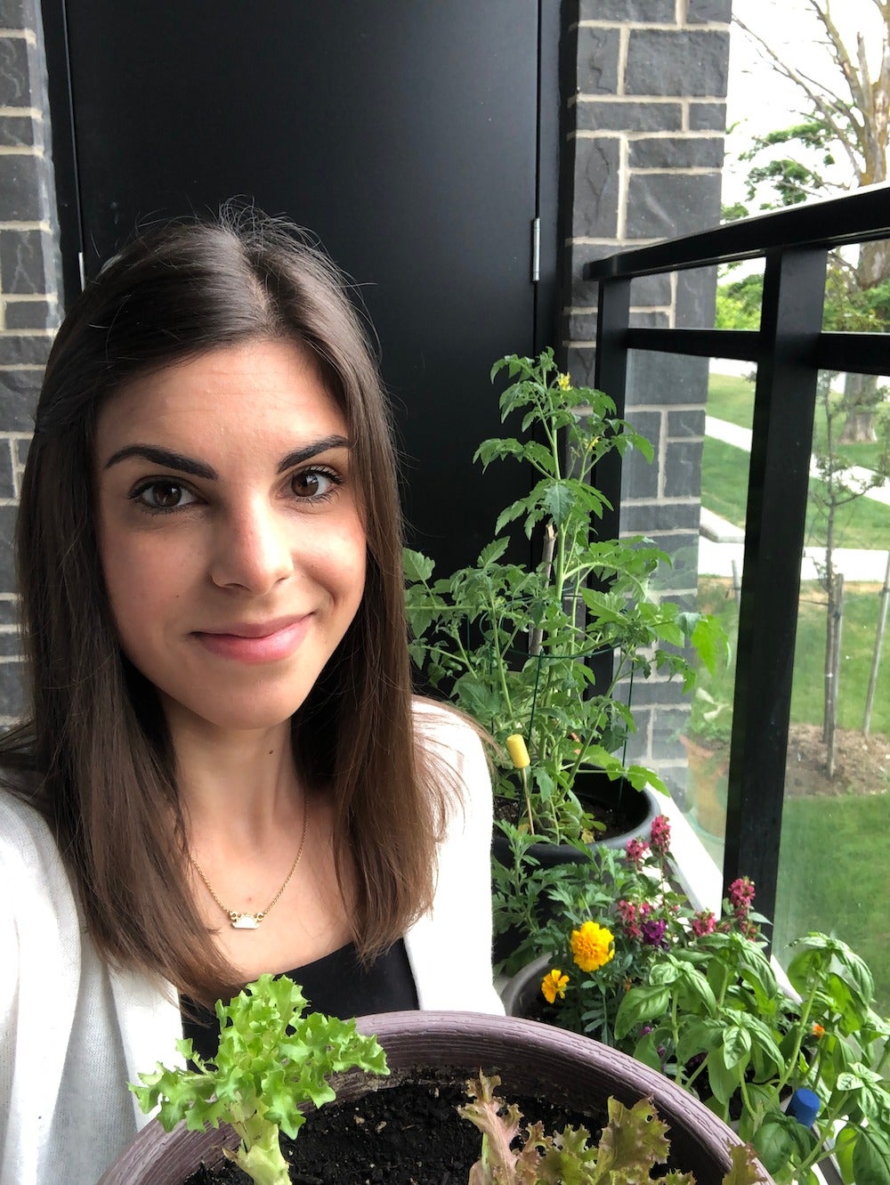 Nicole Pin holds a planter.