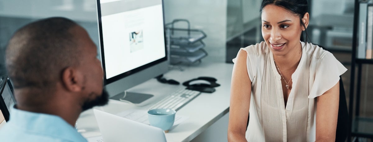 A manager having a discussion with her employee.
