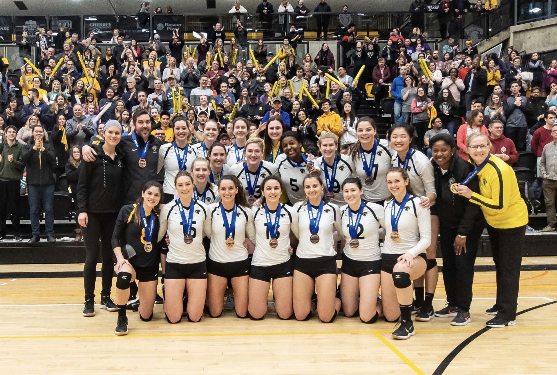 The Waterloo Warriors volleyball team with their bronze medals.