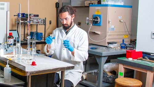 Researcher Keith Cleland in his lab with lab equipment.