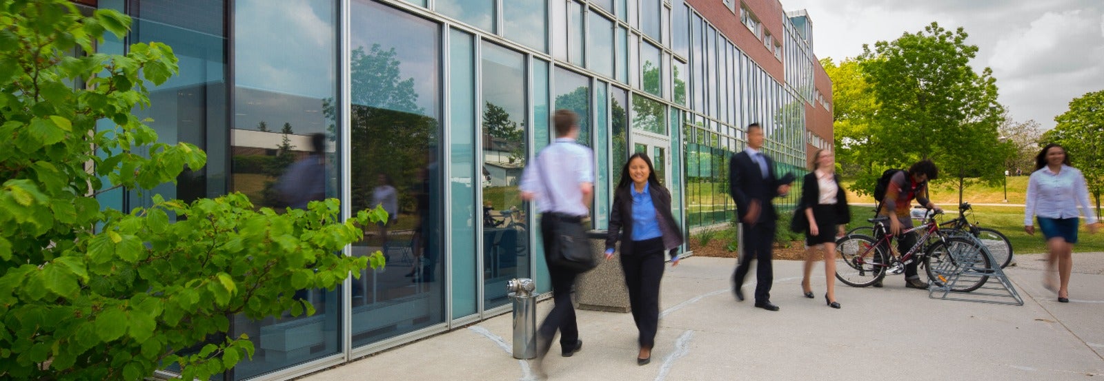People walk outside the Tatham Centre.