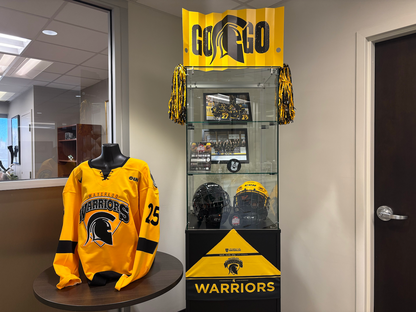 A collection of Warriors hockey memorabilia in the President's Office display.