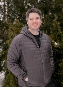  MAN STANDING OUTSIDE IN A JACKET