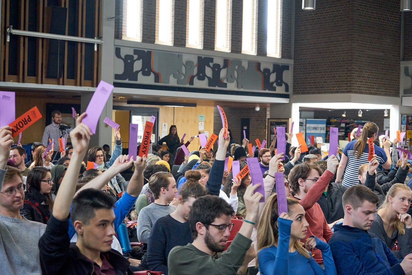 Students vote at a Feds general meeting.
