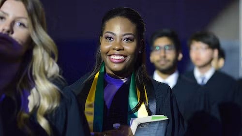 Graduate students prepare to cross the Convocation stage.