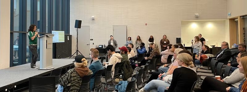 A student speaks at the Waterloo @ the Intersections event.