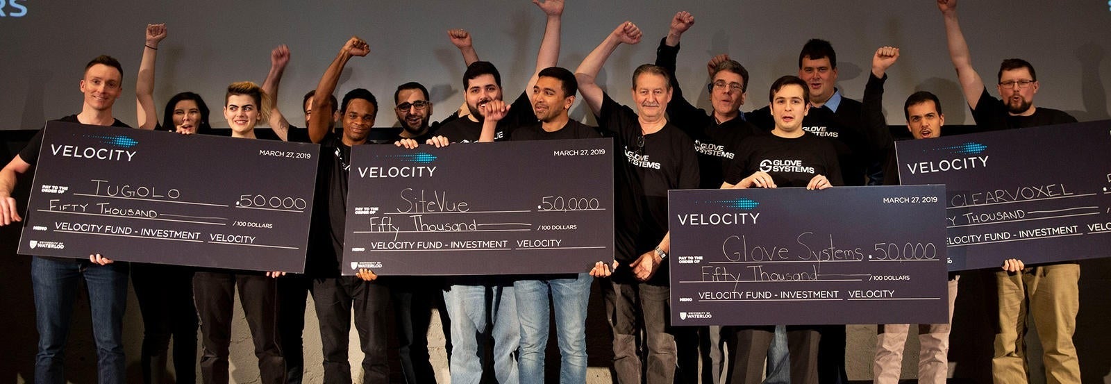 Velocity Fund winners with their oversized cheques.