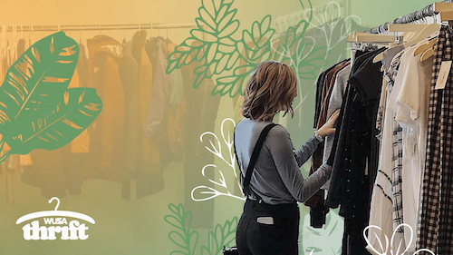 A woman looks through clothing on a rack.