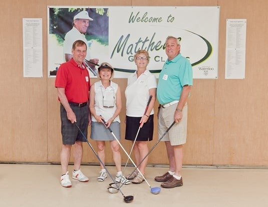 Dave Matthews, son of Burt Matthews and his wife Jane, and retiree Ed Linton and his wife Eileen from the Matthews Golf Classic 2014 golf tournament