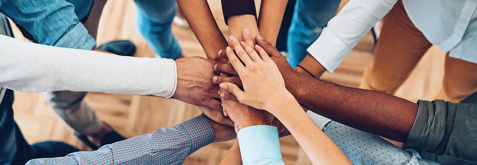 People putting their hands together.