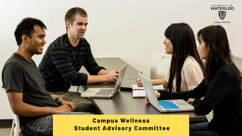 Four people sit at a table.