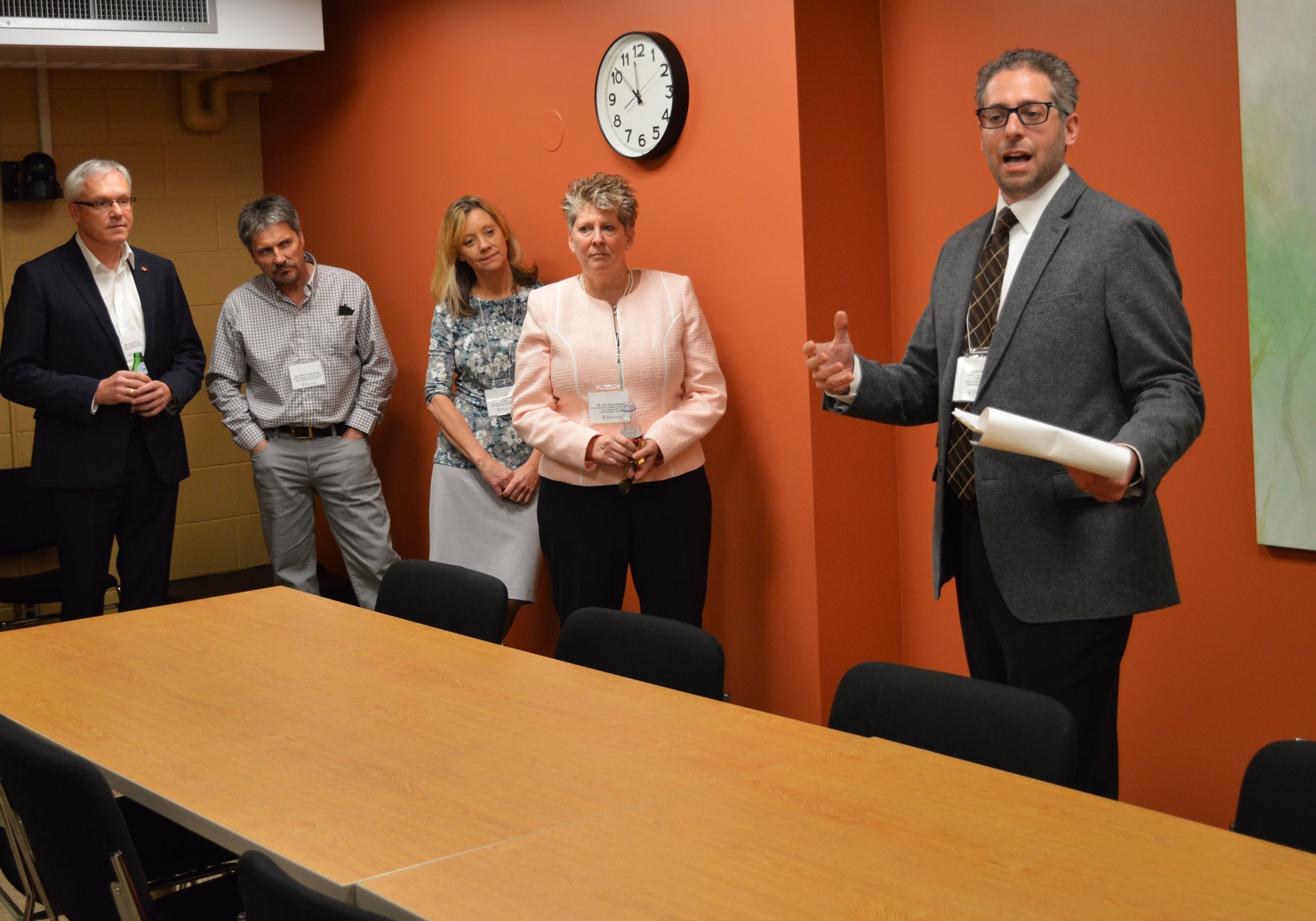 Professor David Moscovitch (right) tours visitors around the CMHR facility.