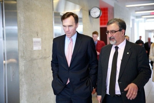 Feridun Hamdullahpur greets Finance Minister Bill Morneau at the University of Waterloo.