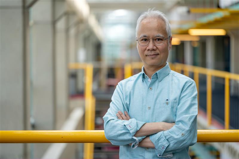 Justin Wan stands in the Davis Centre.