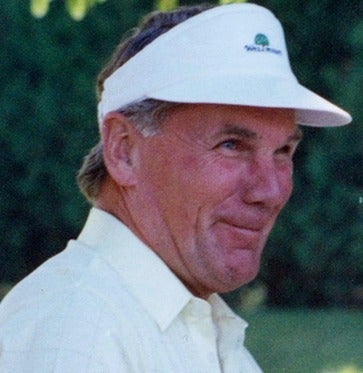 A photo of Burt Matthews golfing.