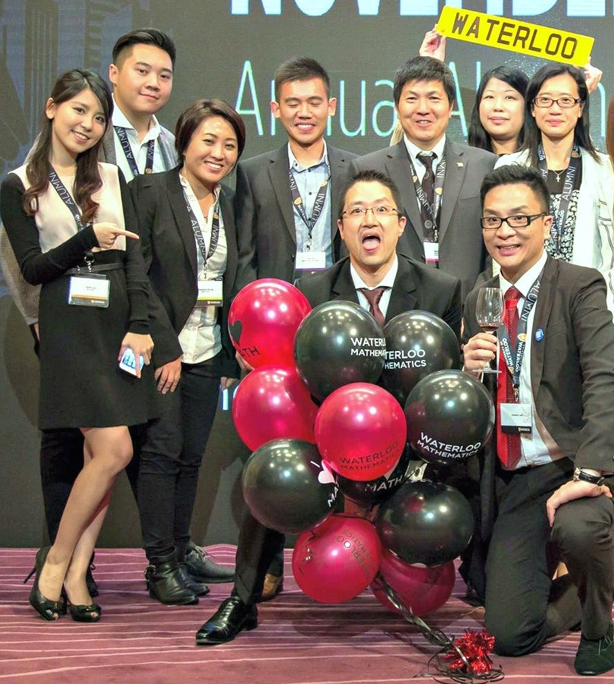 Volunteers at the Hong Kong Alumni Association dinner share the stage.