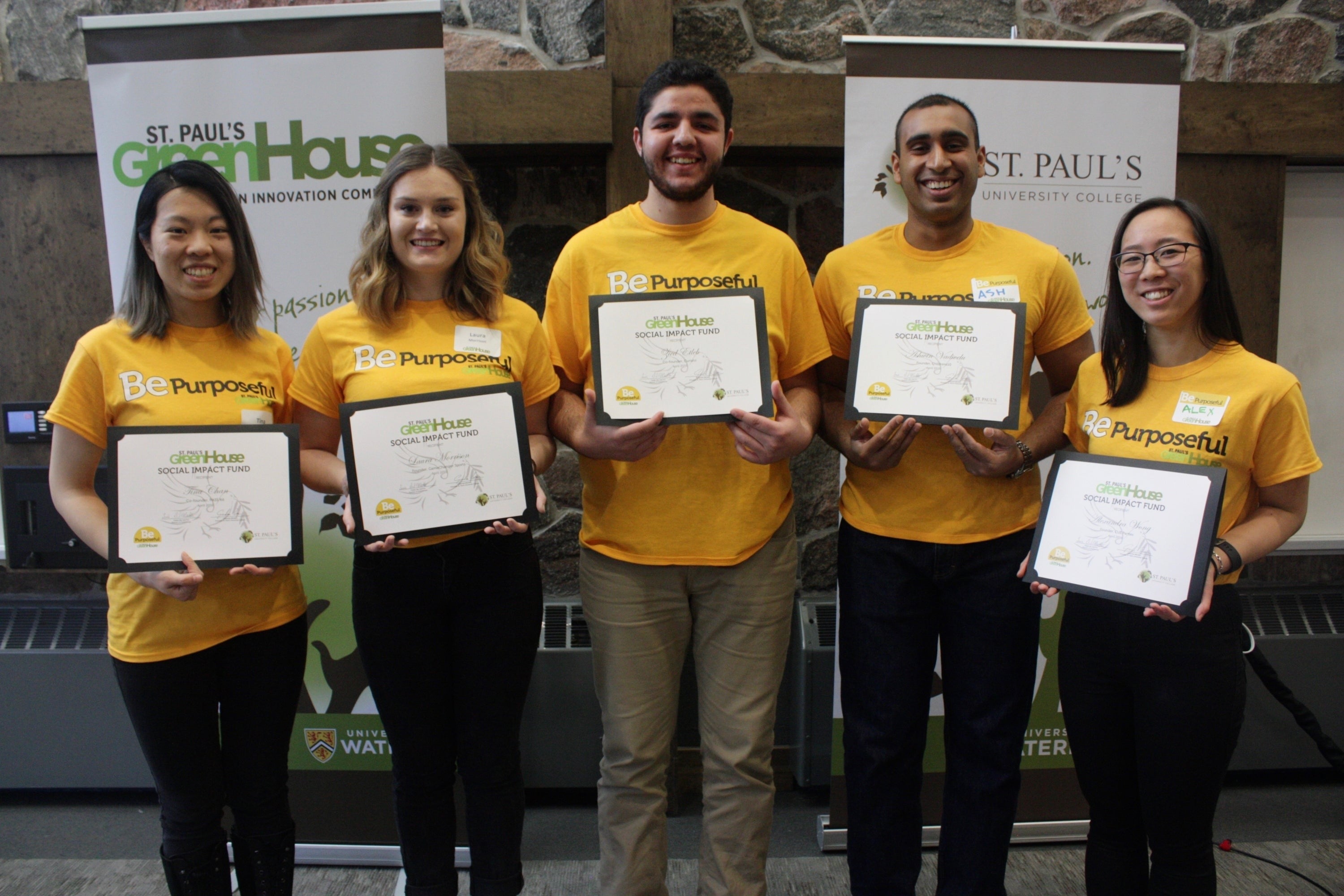 Social Impact Award winners with their awards.