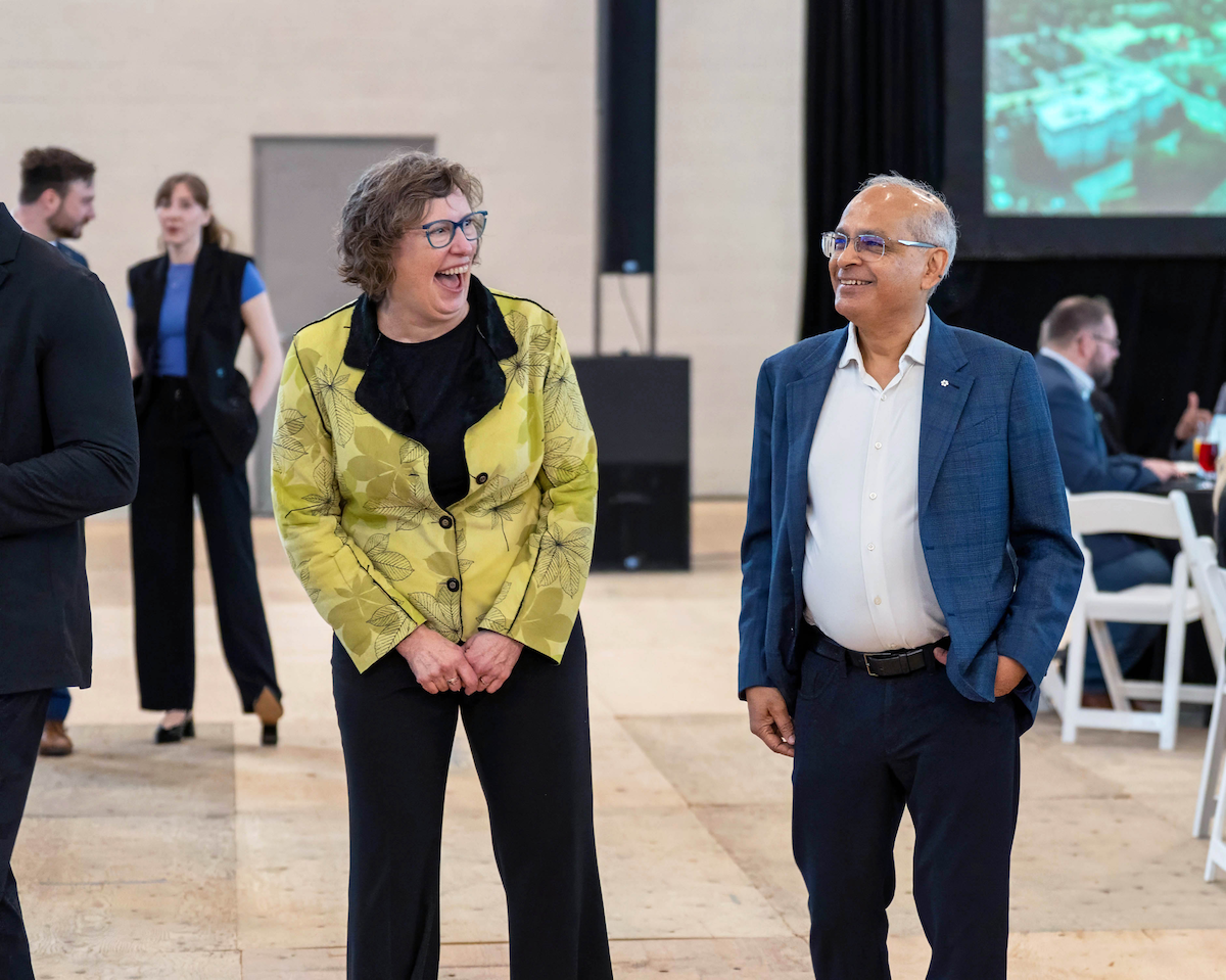 Mayor Dorothy McCabe laughs as she stands next to President Vivek Goel.
