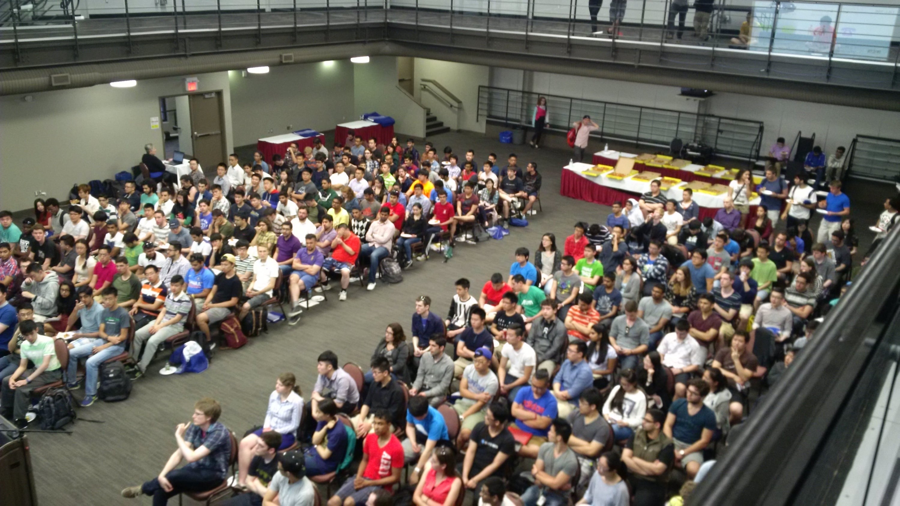 Students attend an employer information session with free pizza.