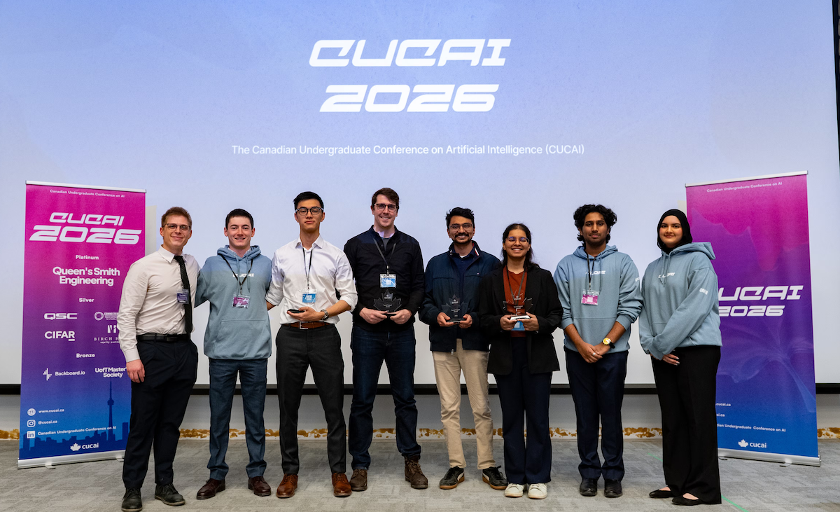 Tony Chan, Christopher Risi, Shivam Singal and Alyssa D'Souza on stage with the Social Impact award.