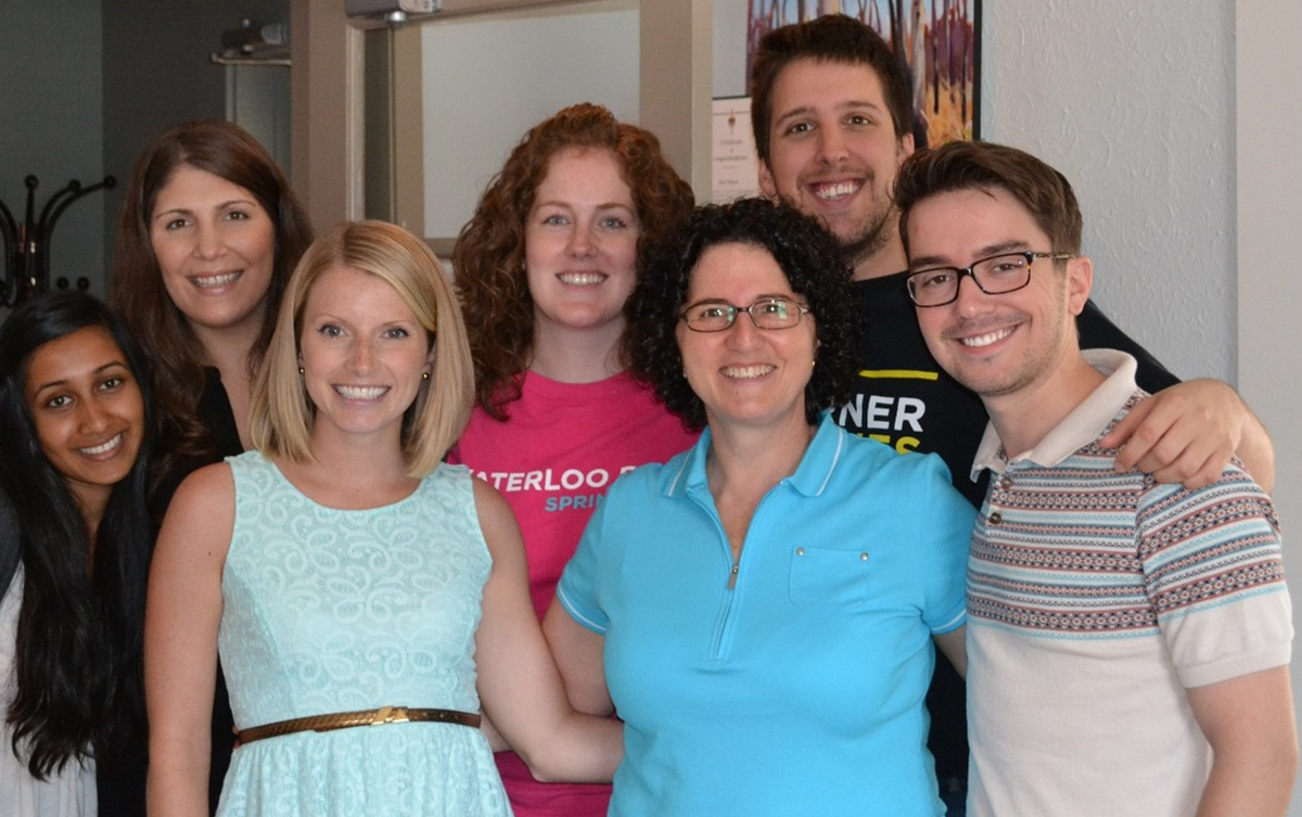 Pam De Leo surrounded by her Residence Life team in 2013.