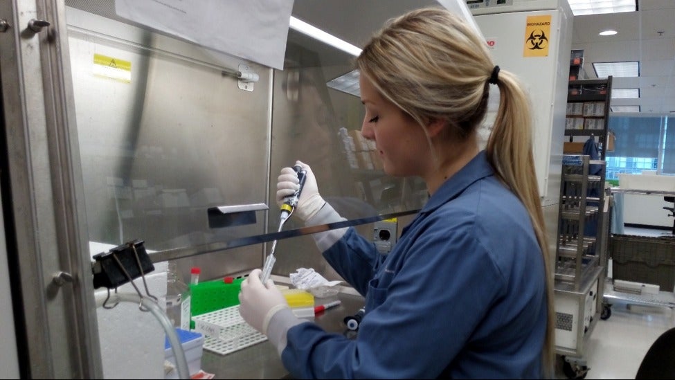 Co-op student Lauren Hummel working in a lab at Princess Margaret Hospital.