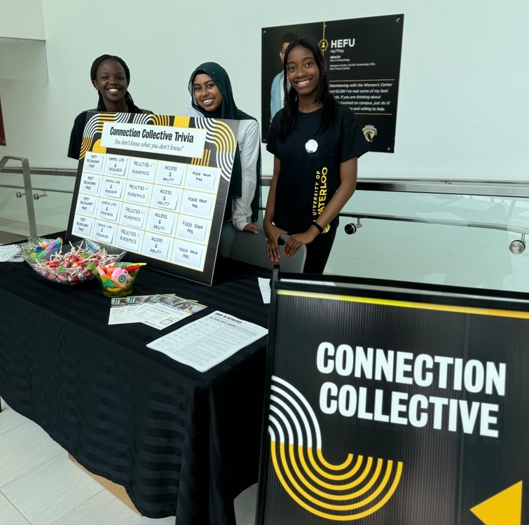 Three members of the Connection Collective at a promotional information booth.