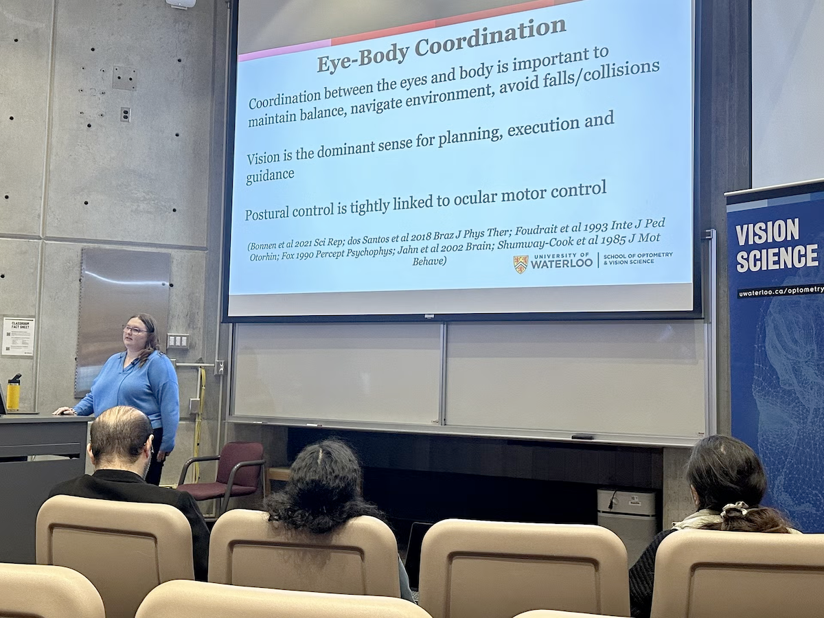 Lauren Hoare presenting in a lecture hall at the 2024 vision science conference.