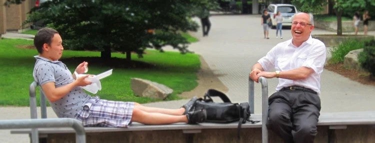 Steve Furino shares a laugh with one of his students.