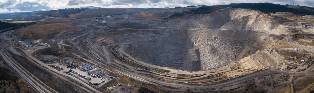 An aerial view of an open pit mining operation.