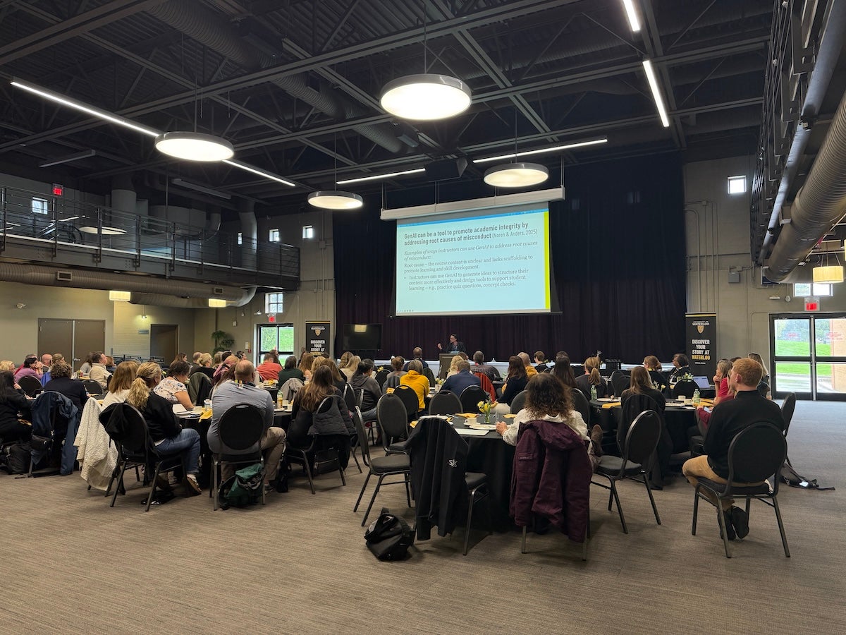 School counsellors sit at round tables in Federation Hall.